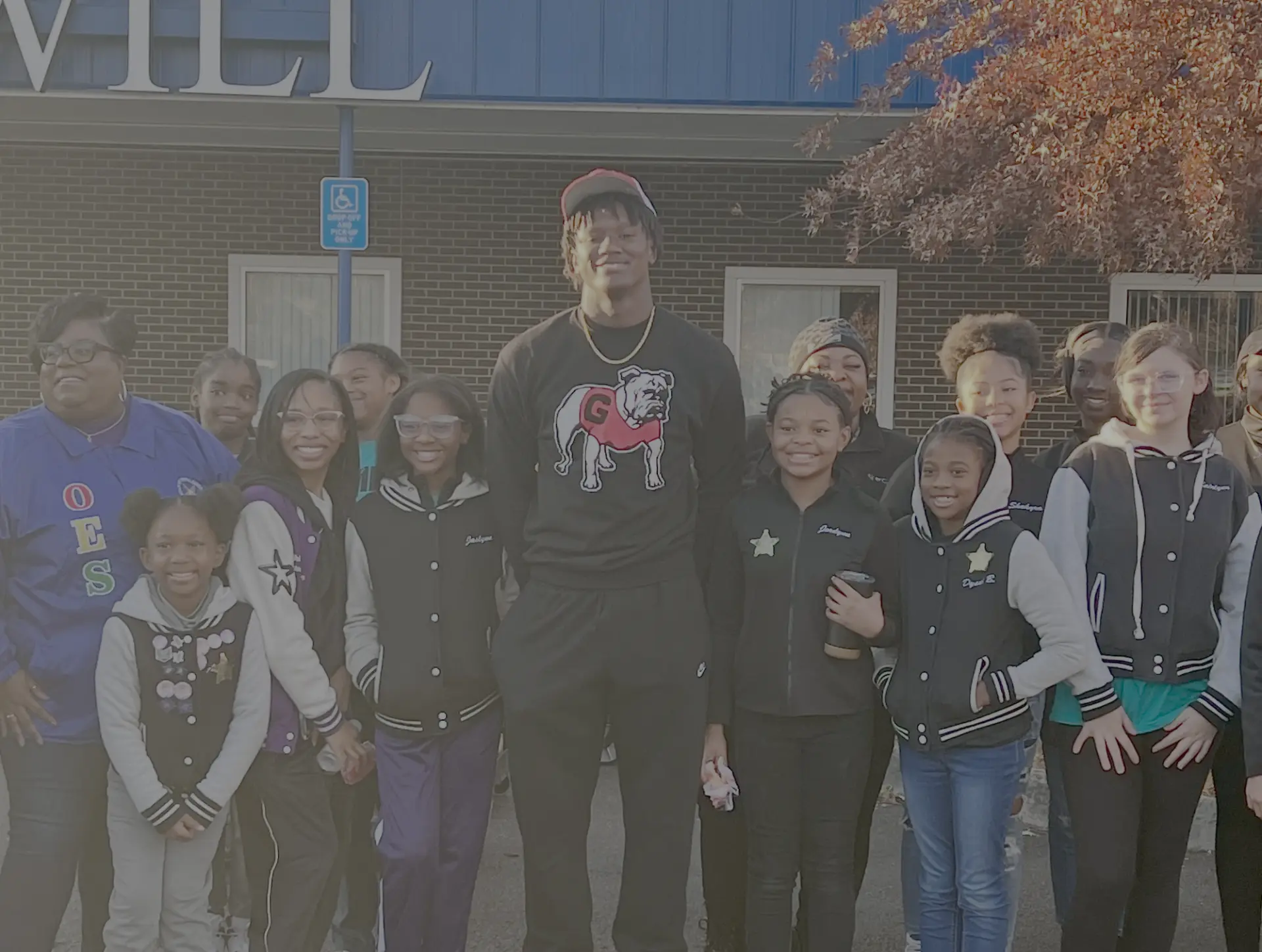 Chris Cole with students and volunteers at the Thanksgiving food drive