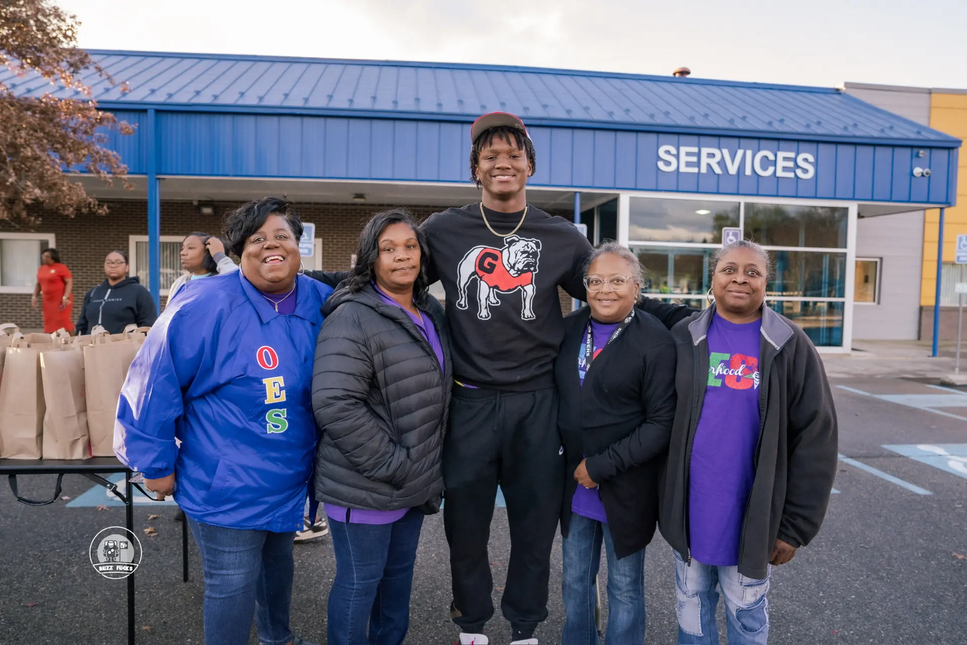 Chris Cole with volunteers who packed groceries for the Thanksgiving food drive